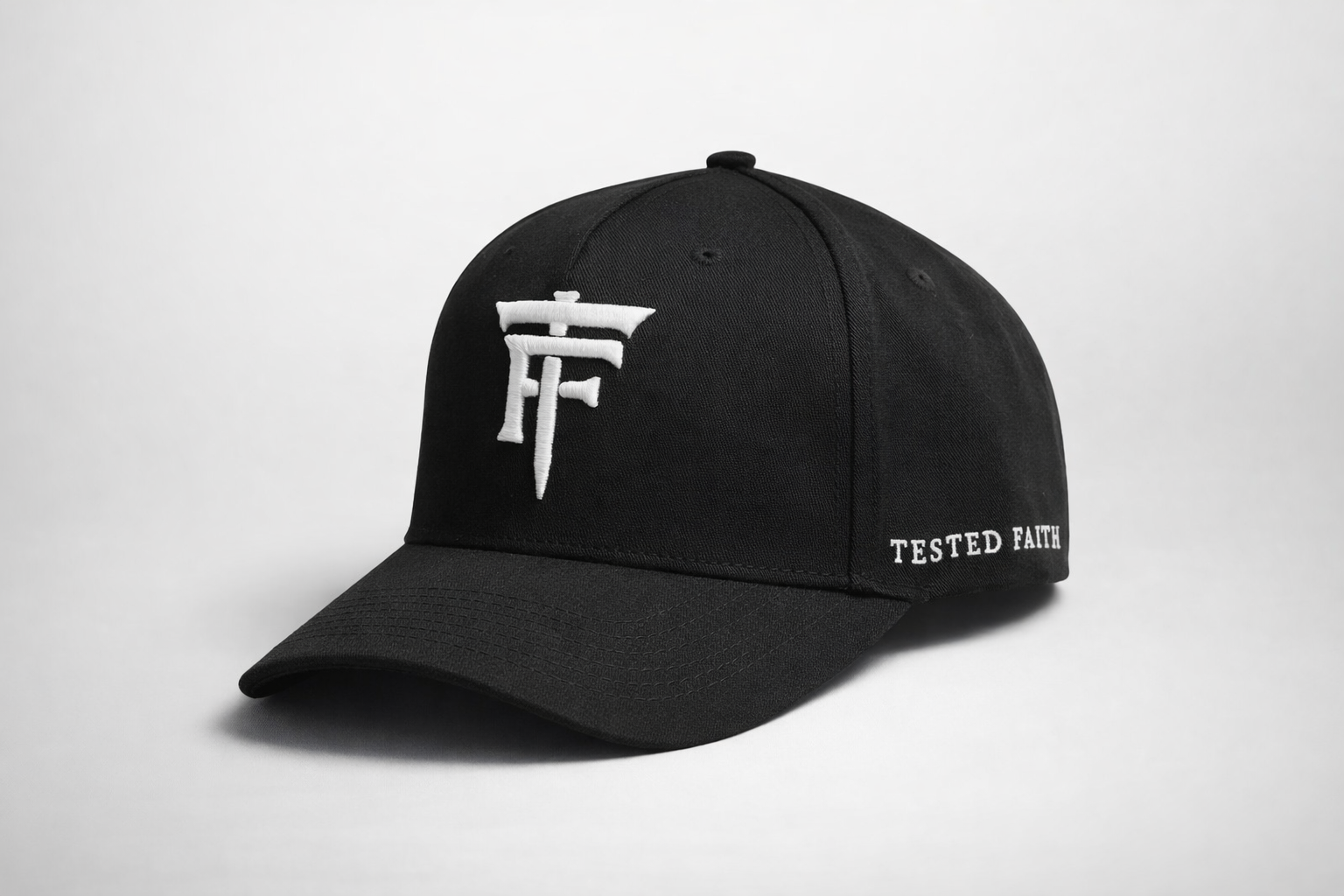 Black cap with white logo and text on a light gray background